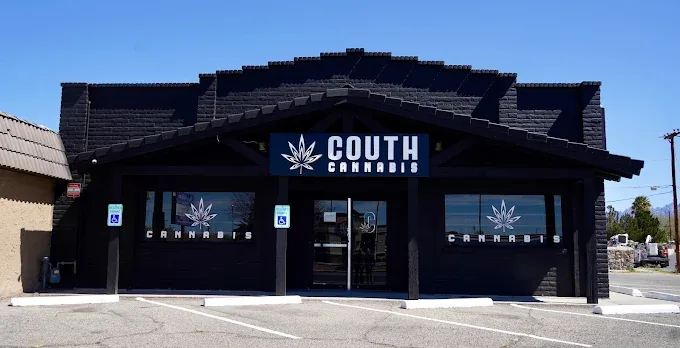 The Couth Cannabis storefront on El Paseo Rd, a dark building with the Couth Cannabis leaf logo above the entrance